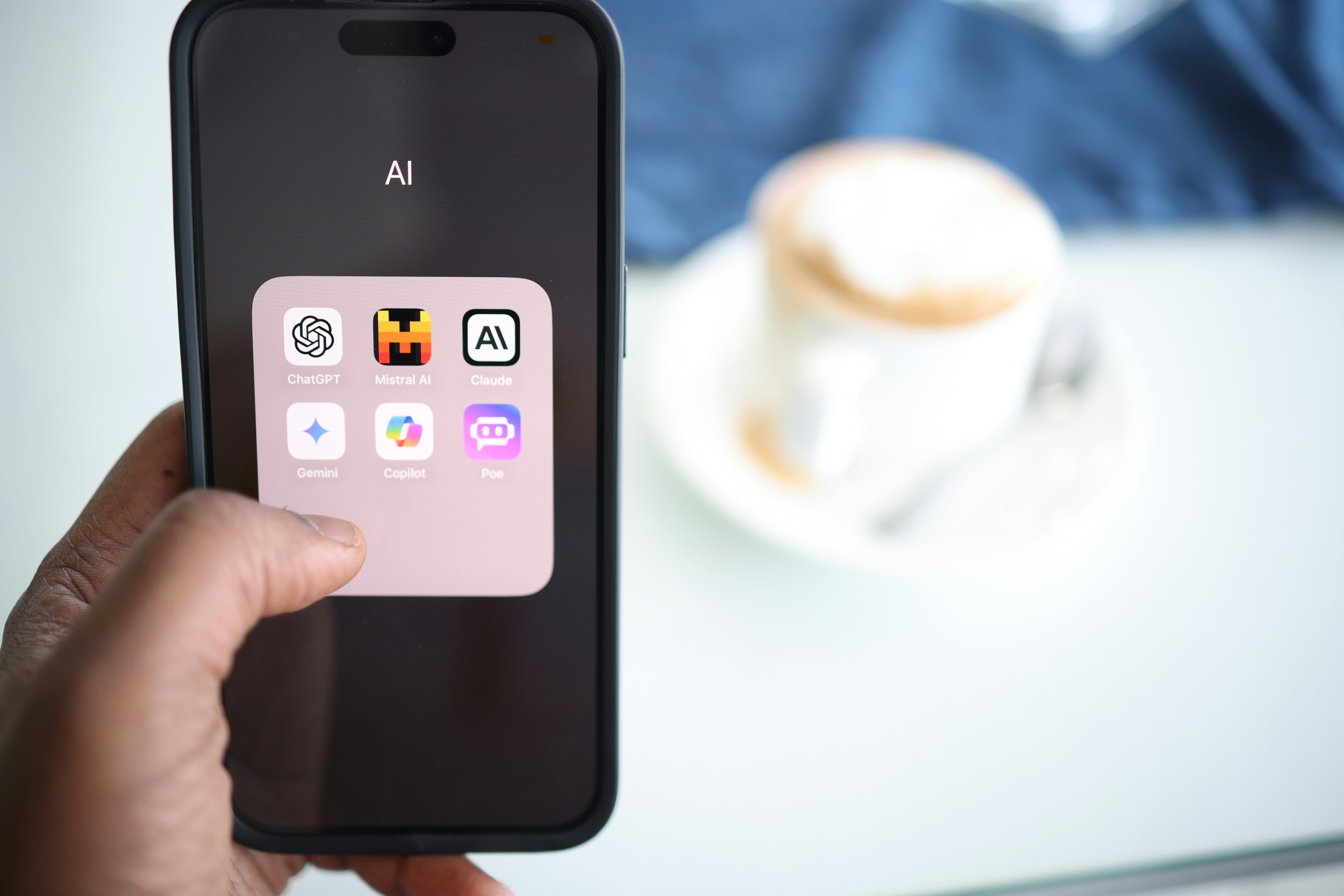 Phone screen open with carious AI apps on the screen